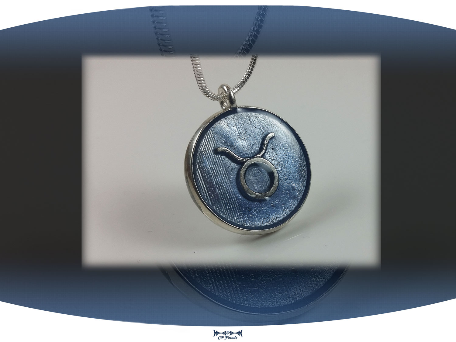 Sterling silver zodiac sign  taurus pendant with light blue resin and star constellation on the back
